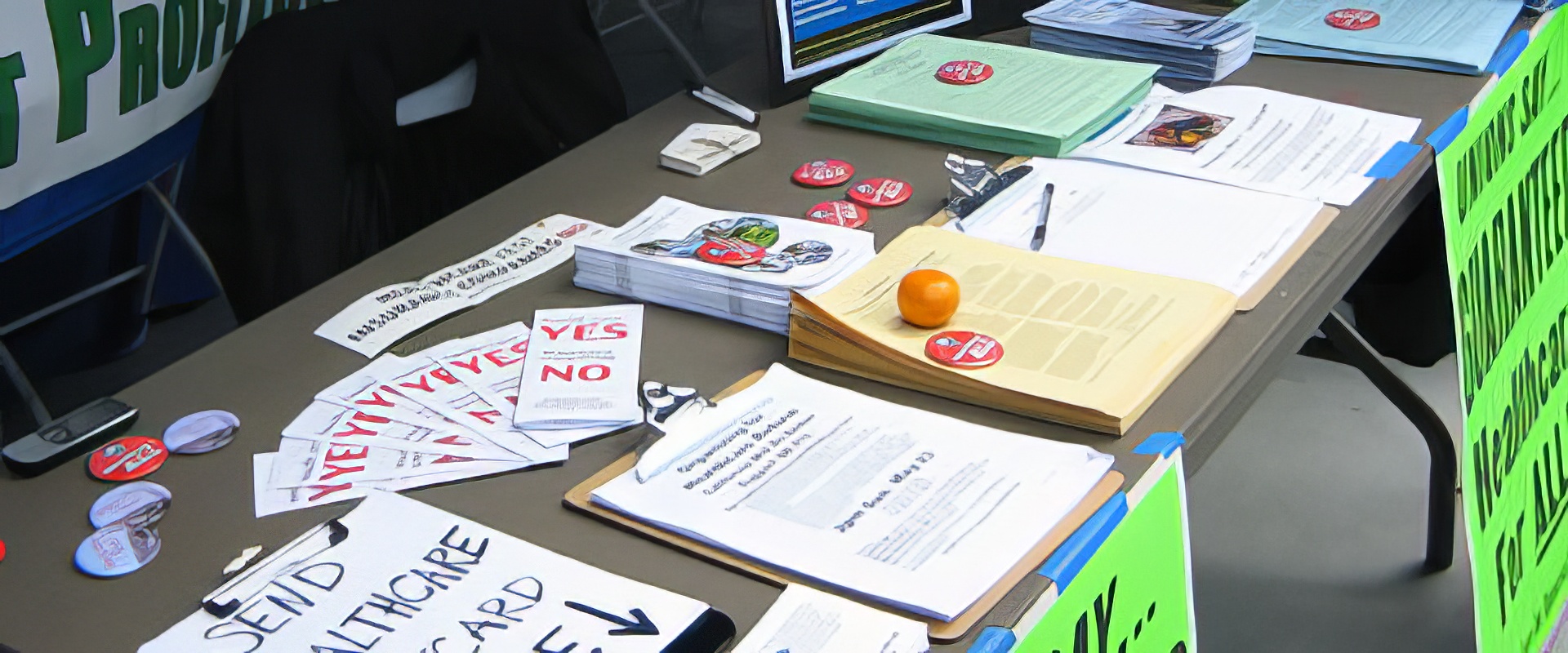 Single Payer Now information table with brochures and postcards